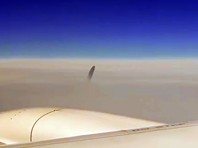 Mysterious UFO Was Seen Right Above The Clouds - Airline Passengers Filmed Outside the Window and Freaked out